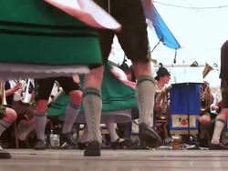 SLO MO Traditional Bavarian Schuhplattler dance performed in a beer tent Stock Footage