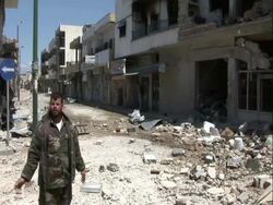 Syrian rebel shows half destroyed town Stock Footage