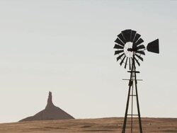 Zoom with windmill and Chimney Rock in the background Stock Footage