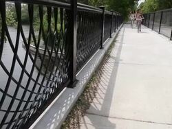 MS TU Two young girls having fun and riding bicycles in urban area near lake and inside park / Minneapolis, Minnesota, United States Stock Footage