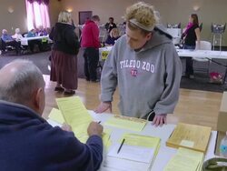 MS Shot of young white middle class woman requests provisional ballot in presidnetial election union hall / Toledo, Ohio, United States Stock Footage