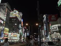 PAN Buildings and people in Shinjuku, Tokyo, Japan. Stock Footage