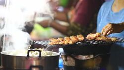 Grilling meat On The Street Stock Footage