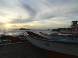 MS PAN View of Sunsets on beach with whispy clouds In Sky / Horcon, Chile Stock Footage