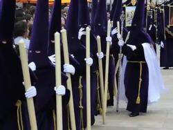 Nazarenos in a procession during Holy Week, Semana Santa, April 2011, Malaga, Spain, Europe Stock Footage