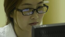 CLose up woman laboratory working on a computer Stock Footage