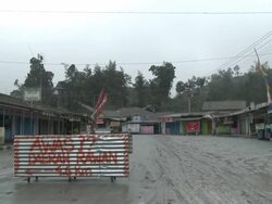 Small village abandoned and coated in volcanic ash mud after eruption of Merapi volcano; Indonesia. 7 November 2010 / AUDIO Stock Footage