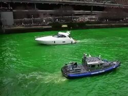 Chicago River Dyed Green In St. Patrick's Day Tradition Stock Footage