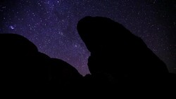 Timelapse of Stars and Moonlight on Rock Formation Stock Footage