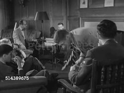 1953: YALE UNIVERSITY SEMINAR: VS Yale senior students gathered around, smoking cigarettes, listening to Bob reading excerpt from novel (SOT). Instructional Video