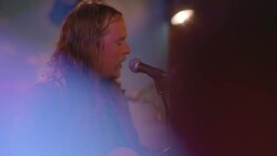 Rock band performs on stage at crowded music venue in Austin, Texas during South By Southwest festival Stock Footage