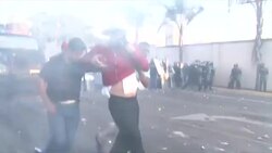 VOICED : 15 heridos en marcha contra reeleccion de Hernandez en Honduras News Clip