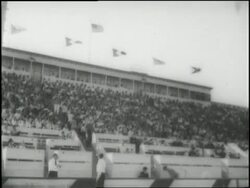 A player fumbles a pass during a women's football game. News Clip