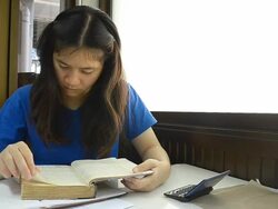 Thai woman suddenly screen a book Stock Footage