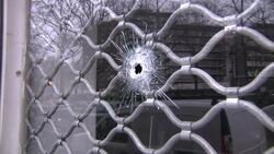 Bullet Hole In Window Of Shop Near Charlie Hebdo Offices News Clip