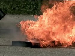 High speed Carbon Dioxide Fire Extinguisher, putting out fire Stock Footage