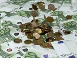 Euro Coins falling on a Pile of 100 Euro Bills, Slow motion Stock Footage