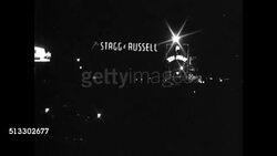 1937: PICCADILLY CIRCUS: CU Sign 'Bar Closed after 10 o'clock, D.O.R.A. Sec. 15.' NIGHT: Street signs 'Stagg &amp; Russell.' CU Sign 'Closing Time 10 o'clock.' NIGHT: WS Street scene, lit signs, buildings (dark). London, England Instructional Video