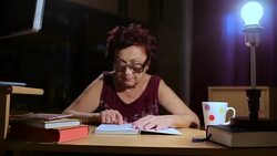 Grandmother reading a book Stock Footage