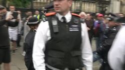 Police Officers Moving Anti-Austerity Protester News Clip