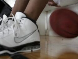 MS young man playing basketball and practicing inside  gymnasium  / Minneapolis, Minnesota, United States  Stock Footage