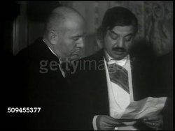 1935: MUSSOLINI MEETINGS:  INT VS Fascist Italy dictator Benito Mussolini (1883-1945) talking to France Prime Minister Pierre Laval (1883-1945) in meeting, Rome. EXT VS Mussolini standing w/ United Kingdom P.M. Ramsay MacDonald (1866-1937). Instructional Video