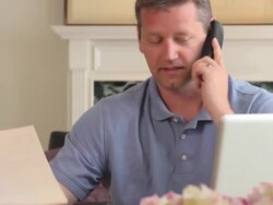 Frustrated Man Argues with Large Company over the Phone Stock Footage