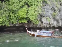 MS Shot of Tourists snorkeling at Ko Chueak Reef with Long tail boat, Marine National Park / Ko Hai, Krabi, Thailand Stock Footage