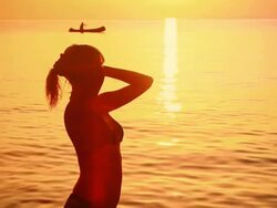 HD: Silhouette Of A Woman At Sunset Stock Footage