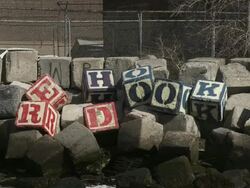 Sculpture art as concrete barrier turned into building blocks spelling "Red Hook" in Brooklyn Stock Footage