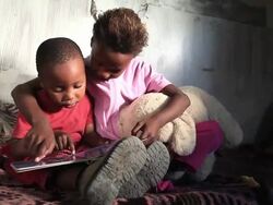 Township kids reading Stock Footage