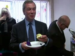 Nigel Farage eating a UKIP decorated cupcake News Clip
