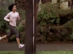 WS TS Woman jogging on sidewalk / Portland, OR, USA Stock Footage