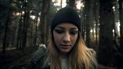 Woman experiencing panic attack in the forest Stock Footage