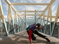 MS Shot of young man dancing on bridge in urban area / Minneapolis, Minnesota, United States Stock Footage