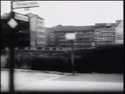 B/W 1961 PAN of Berlin Wall + buildings along border of East + West Berlin / Germany / newsreel Stock Footage