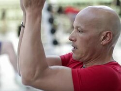 Mixed race man working out in the gym Stock Footage