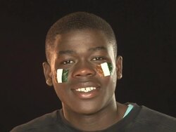 Smiling Patriotic Ivory Coast male - HD &amp; PAL Stock Footage