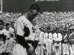 B/W 1939 solemn Lou Gehrig chewing gum + looking down then looking up in crowded stadium / farewell Stock Footage