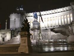 MS, Traffic in front of Monumento Nazionale a Vittorio Emanuele II (National Monument of Victor Emmanuel II) at night, Rome, Italy Stock Footage