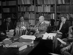 1953: YALE UNIVERSITY HISTORY:  VS Historian & Yale University History professor Samuel Flagg Bemis (1891-1973) sitting in library w/ Yale students, talking about American foreign policies (SOT). Lecture Instructional Video