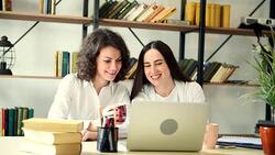 Two beautiful girls with laptop Stock Footage