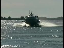 Hovercraft approaching along river Danube, Romania Stock Footage