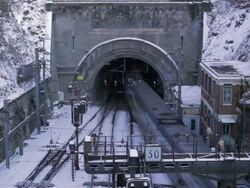Train departing into tunnel, winter Stock Footage