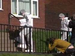 Forensics outside flat, suspected murder scene News Clip