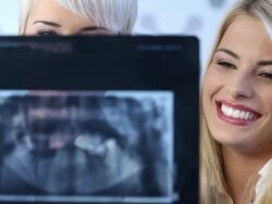 Dentist showing female patient x-rays Stock Footage