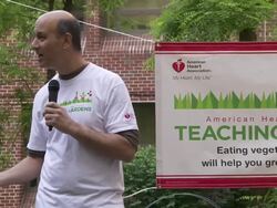David Lefkowitz with parents and students at American Heart Association Teaching Gardens Planting in Harlem Stock Footage