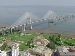 WS AERIAL  View of Vasco da Gama Bridge, Tagus River and Parque das Nacoes / Lisbon, Portugal   Stock Footage