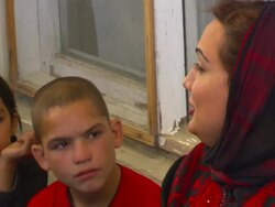 MS Shukria Barakzai talking  warmly to children at daycare center AUDIO / Kabul, Province, Afghanistan Stock Footage