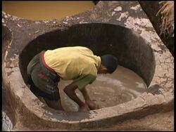 Boy Hand Dyes Leather in Vats of Colors, Fez Morocco Stock Footage